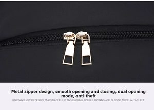 Close-up of golden dual hardware zippers on durable black waterproof nylon backpack