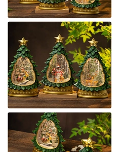 Detail of Christmas tree snow globe with Santa and reindeer scenes on wooden table