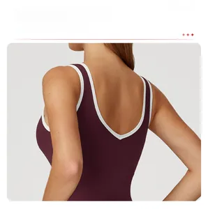 Detail of V-back yoga tank top with contrasting white piping and deep purple fabric