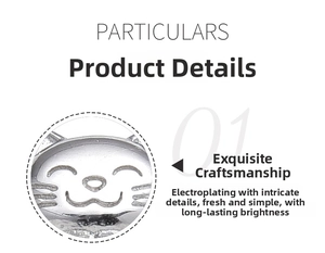 Macro detail of the 925 sterling silver ring showing a cute smiling cat engraving