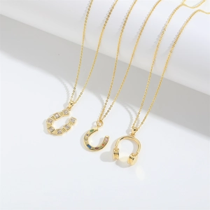 Vintage lion pendant necklaces in gold finish with horseshoe and headphone charms