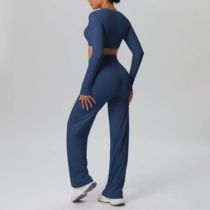 Close-up of slim-fit dark blue long sleeve crop top and high waist flared yoga pants