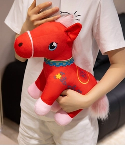 Detail of red Chinese style plush horse with blue wavy collar and floral embroidery