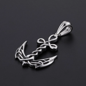 Close-up of vintage titanium steel anchor pendant with Celtic knot pattern and metallic luster