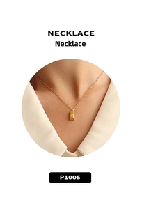Detail of 18K gold plated necklace with engraved rectangular bar pendant on O-chain