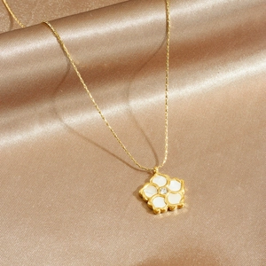 Elegant 18K gold plated necklace featuring a white shell flower pendant on champagne silk