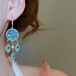 French palace style luxury drop earrings with blue marquise stones and gold frame
