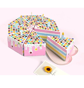 Top view of eight triangle-shaped paper gift boxes forming a colorful cake with paper candles