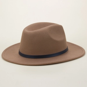 Side view of a brown wool fedora hat featuring a stylish dark blue leather band
