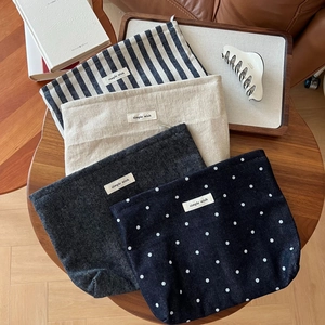 Artistic large canvas toiletry bags in polka dot, striped, and solid vintage designs
