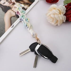 Detail of handmade macaron cotton weave flower keychain with gold metal lobster clasp