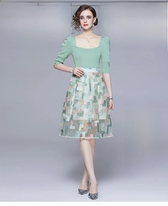 Detail of square neck knit top and geometric mosaic embroidery on fashion midi dress
