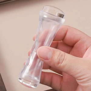 Dual-head nail art stamper tool with clear silicone heads and ergonomic curved handle