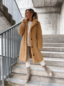 Close-up of the plush teddy fleece material and warm camel tone of this long winter coat