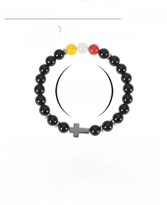 Detail of 8mm obsidian and citrine beaded bracelet with cross charm and elastic cord