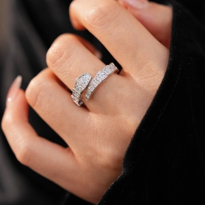 Macro detail of silver snake ring featuring cubic zirconia pavé setting on hexagonal scales