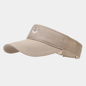 Detail of khaki visor with white smiley face embroidery and canvas texture