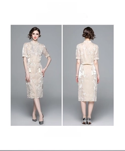 Detail of champagne high-waist slit skirt set with traditional mandarin collar embroidery