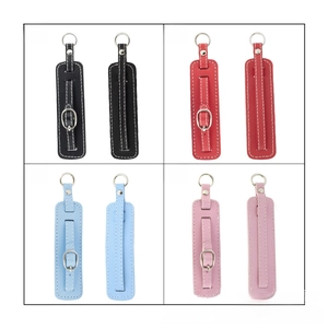 Detail showing colorful PU leather luggage tags with adjustable metal buckles and stitching