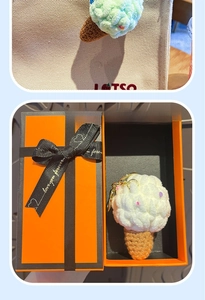 Handmade crochet ice cream keychain in orange gift box shown as a bag pendant detail