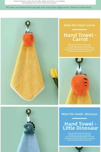 Detail of hanging coral velvet hand towel featuring cartoon carrot and dinosaur designs