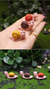 Miniature resin snail figurines in yellow and brown for succulent garden landscape