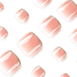 French tip press-on toenails with nude pink gradient and sparkling gold glitter finish
