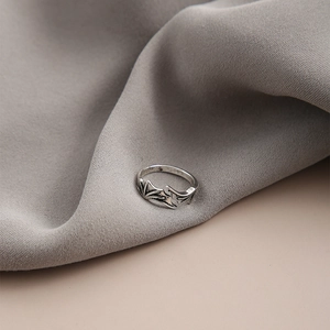 Detailed close-up of retro bat wing adjustable open rings in an antique silver finish