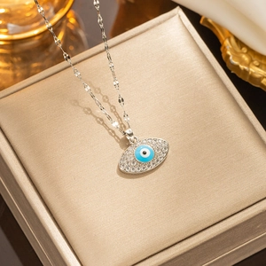 Silver stainless steel evil eye pendant necklace with blue enamel and crystal accents