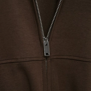 Women's dark brown sporty tracksuit featuring a premium metal zipper and knit fabric texture