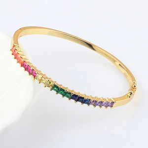 18k gold plated oval bangle with rainbow rectangular zircon gemstones on white background