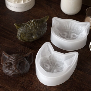 Detail view of the 3D cat head silicone mold with finished aromatic resin candle crafts