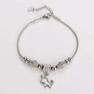Detailed view of silver unicorn pendant with sparkling crystals on a snake chain bracelet