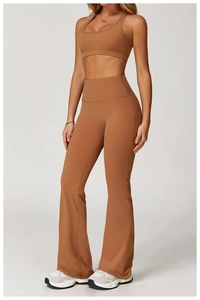 Close-up of high-waisted brown flared yoga pants with backless sports bra set