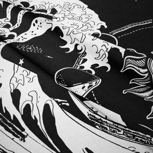 Detailed macro view of woven fabric texture with black and white Great Wave art print