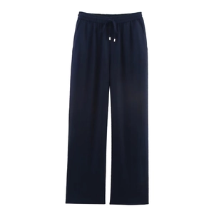 Detail of navy blue wide-leg linen trousers showing drawstring elastic waist and fabric texture