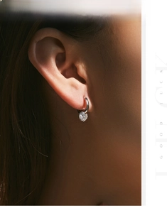 Close-up of a silver leverback earring with a 1-carat brilliant moissanite stone