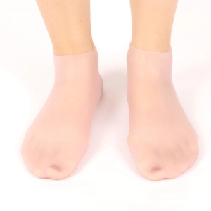 Waterproof silicone moisturizing socks in skin tone for softening foot calluses