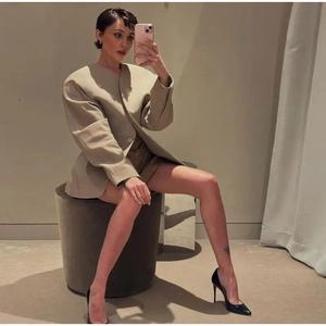Women's oversized beige blazer with short sleeves and deconstructed silhouette styling