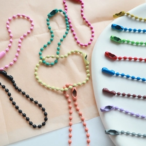 Close-up of colorful 2.4mm painted metal bead chains with secure connectors for DIY
