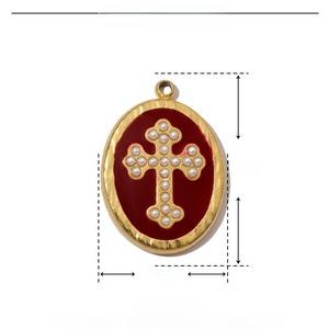 Macro detail of a 20x14mm red enamel cross pendant with ABS pearls and gold plating