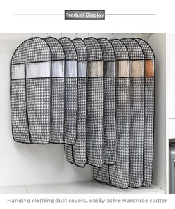 Detail of houndstooth garment covers with PVC window and various lengths in a closet