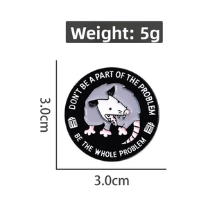 Detail showing a 3cm enamel pin with cartoon opossum and humorous English text