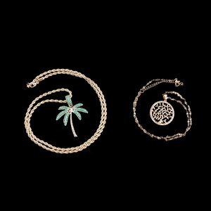 Gold plated coconut tree and tree of life pendants on chains with green stones