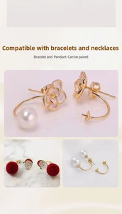 Close-up of 14K gold plated C-shaped butterfly earring backs with pearl base for DIY jewelry