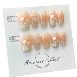 Handmade press-on nails with orange pink gradient and 3D tulip floral design