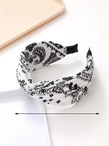 Detailed view of paisley pattern knot headband with dimensions showing 39cm circumference