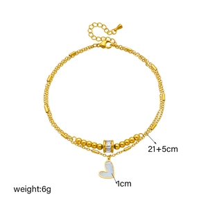 Double-layered 18K gold-plated heart anklet with zircon ring and beads on white background