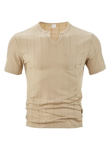 Detail of khaki waffle knit fabric texture and V-neck with pocket on men's casual shirt