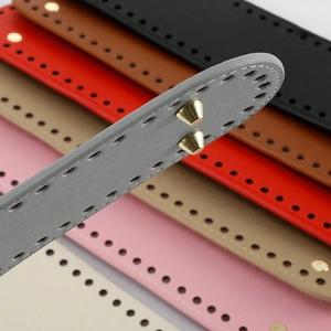 Close-up of colorful PU leather bag bases with precision pre-punched holes and gold rivets